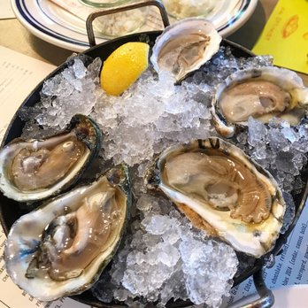 The Optimist - Oysters!  Lemon clockwise:  Great White, Huckleberry, Barrett Cove, 2 Pelican Reef - Seafood Near Me - Atlanta, Georgia