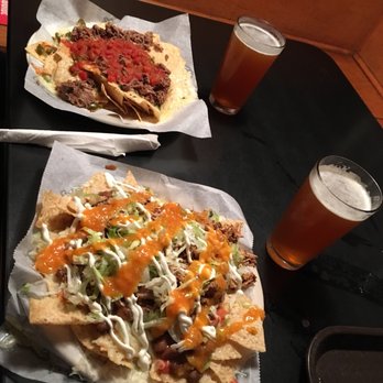 Nacho Mama's - Simple nachos with beef and step daddy nachos with pulled pork. Both with a pint of Riverwatch Route 104 pale ale. - Mexican Near Me - Augusta, Georgia Nacho Mama's - Simple nachos with beef and step daddy nachos with pulled pork. Both with a pint of Riverwatch Route 104 pale ale. - Mexican Near Me - Augusta, Georgia
