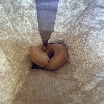 Donut Guys - Two glazed donuts I purchased. One of them I broke in half to try it. Gross. - Donuts Near Me - Houston, Texas
