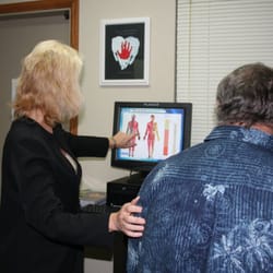 Brenda Hooper DC - Dr. Hooper adjusting patient with ProAdjuster