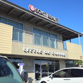 Little Ox Coffee - Front of Business: Daytime - A sign on the first floor of a building that says, "LITTLE OX COFFEE" in solid white. - Coffee & Tea Near Me - Fullerton, California Little Ox Coffee - Front of Business: Daytime - A sign on the first floor of a building that says, "LITTLE OX COFFEE" in solid white. - Coffee & Tea Near Me - Fullerton, California