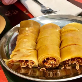 Lhasa Liang Fen - Yellow fen: a soft noodle rolled around small, spicy, crunch noodles, then sliced. - Chinese Near Me - Elmhurst, New York