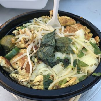 iPho - a bowl of food with chopsticks in it - Food Trucks Near Me