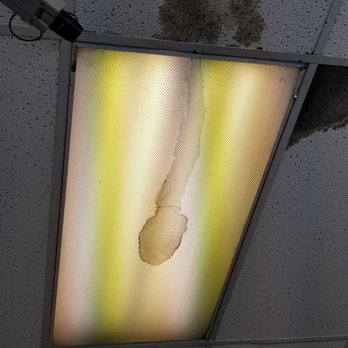 Tony Ray Laundromat - Ceiling and light near dryers showing leakage into the light and surrounding tiles. Tiles were water damaged throughout - Laundromat Near Me - Indianapolis, Indiana Tony Ray Laundromat - Ceiling and light near dryers showing leakage into the light and surrounding tiles. Tiles were water damaged throughout - Laundromat Near Me - Indianapolis, Indiana