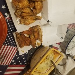 a box of buffalo wings and a box of chicken wings
