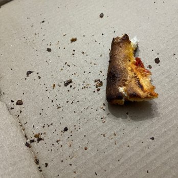 Padrino's II Pizza Restaurant - a half eaten pizza - Pizza Near Me - Dumfries, Virginia Padrino's II Pizza Restaurant - a half eaten pizza - Pizza Near Me - Dumfries, Virginia