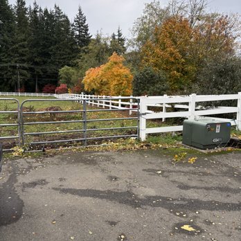 Gatica Lawn Care - The gate at the top of our driveway and view of the chip pile in the pasture. This is where we would love you to drop off chips! - Tree Services Near Me Gatica Lawn Care - The gate at the top of our driveway and view of the chip pile in the pasture. This is where we would love you to drop off chips! - Tree Services Near Me