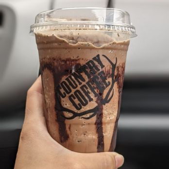 Country Coffee - a hand holding a cup of coffee - Coffee & Tea Near Me - Fairview, Oregon Country Coffee - a hand holding a cup of coffee - Coffee & Tea Near Me - Fairview, Oregon
