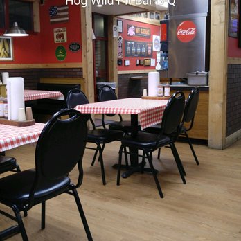Hog Wild Pit Bar-B-Q - ows tables and chairs in a restaurant - Fast Food Near Me - Omaha, Nebraska Hog Wild Pit Bar-B-Q - ows tables and chairs in a restaurant - Fast Food Near Me - Omaha, Nebraska