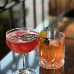Mezcal old fashioned (right)  POMEGRANATE MOJITO (left)