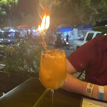 Zitla - Mezcal cocktail served with a burning stick of rosemary. - Mexican Near Me - Playa del Carmen, ROO