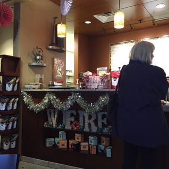 Wifire Community Space - a woman standing in front of a counter - Coffee & Tea Near Me - Freeland, Washington