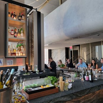 Electric Lemon - a bar with people sitting at it - New American Near Me - New York, New York Electric Lemon - a bar with people sitting at it - New American Near Me - New York, New York