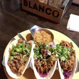 Pulled pork tacos with a side of salsa Pulled pork tacos with a side of salsa
