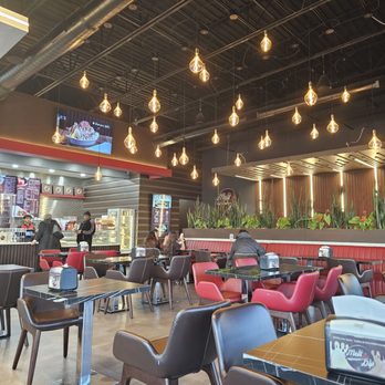 Melt N Dip - The other half of the dining area with tables and chairs - Coffee & Tea Near Me - Fishers, Indiana
