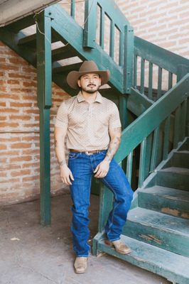 Men's Western Apparel - What You’ll Find
Shirts: From snap-front western shirts to embroidered signature pieces, we carry iconic names like Rock & Roll Denim, Stetson and Scully.
Jeans: Premium denim with fit and style built for the boots.
Jackets & Outerwear: Think quilted leather jackets and rugged, durable styles designed to last.
Boots: Handpicked cowboy boots from classic leathers to more daring fashion-forward designs.
Hats: Complete your look at our Hat Bar customize a straw or felt hat with bands, feathers, stencils, and more for a one-of-a-kind piece.
Accessories: Belts, buckles, bolo ties, wallets, and jewelry all in western style with a luxe twist. Men's Western Apparel - What You’ll Find
Shirts: From snap-front western shirts to embroidered signature pieces, we carry iconic names like Rock & Roll Denim, Stetson and Scully.
Jeans: Premium denim with fit and style built for the boots.
Jackets & Outerwear: Think quilted leather jackets and rugged, durable styles designed to last.
Boots: Handpicked cowboy boots from classic leathers to more daring fashion-forward designs.
Hats: Complete your look at our Hat Bar customize a straw or felt hat with bands, feathers, stencils, and more for a one-of-a-kind piece.
Accessories: Belts, buckles, bolo ties, wallets, and jewelry all in western style with a luxe twist.