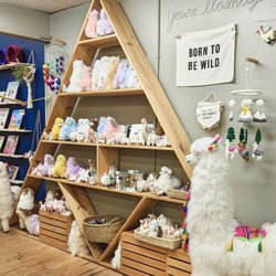 Fair and Square Imports - Our ever-popular "Llama Wall!" Feel free to hug and squeeze them all.