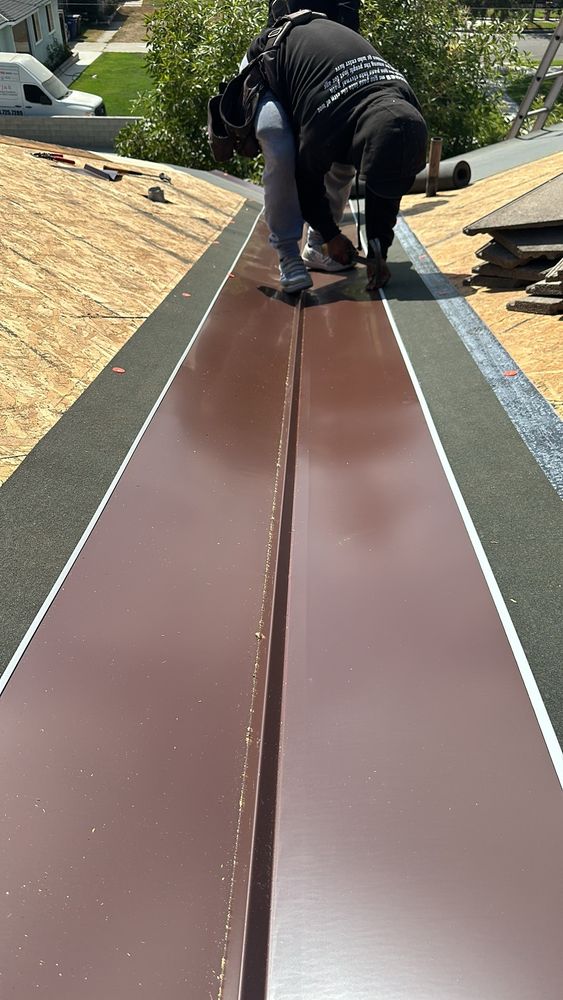 Slide of T’s Roofing 