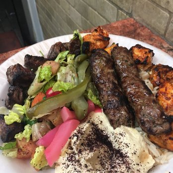 Al Nour - Al Nour (combo) plate with chicken, lamb, and kofta kebab. All three were amazing! It also comes with salad, hummus, and pita. - Lebanese Near Me - Astoria, New York