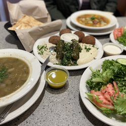 Aladdin's Eatery - Independence - Lentil Soup, Veggie Combo, Pita Wedges, V-Nine Soup, Falafel Salad (divided onto 2 plates), Aladdin dressing, & Lemon/Tahini dressing