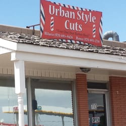 Urban Style Cuts - Small sign outside on top of the building. Just look for the laundromat Wash sign which is next door to them.
