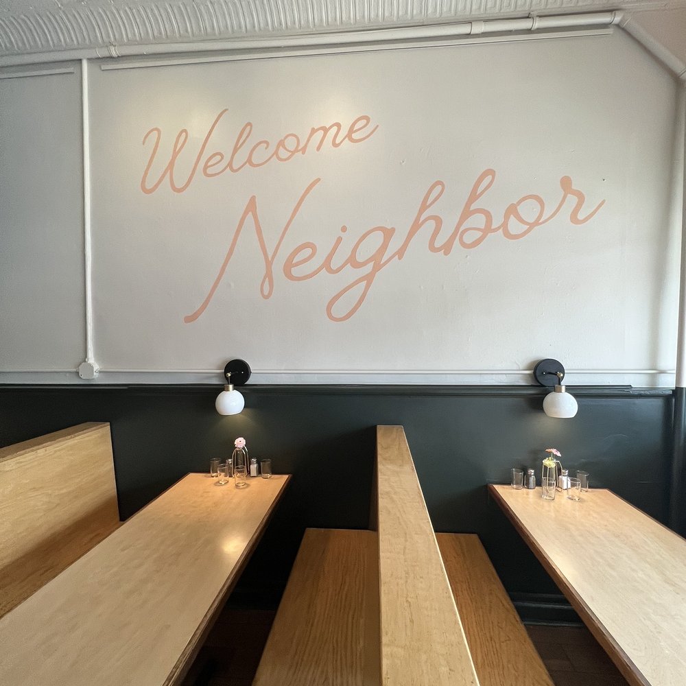 Neighbor - a row of benches in front of a welcome sign - Comfort Food Near Me - Richmond, Virginia Neighbor - a row of benches in front of a welcome sign - Comfort Food Near Me - Richmond, Virginia