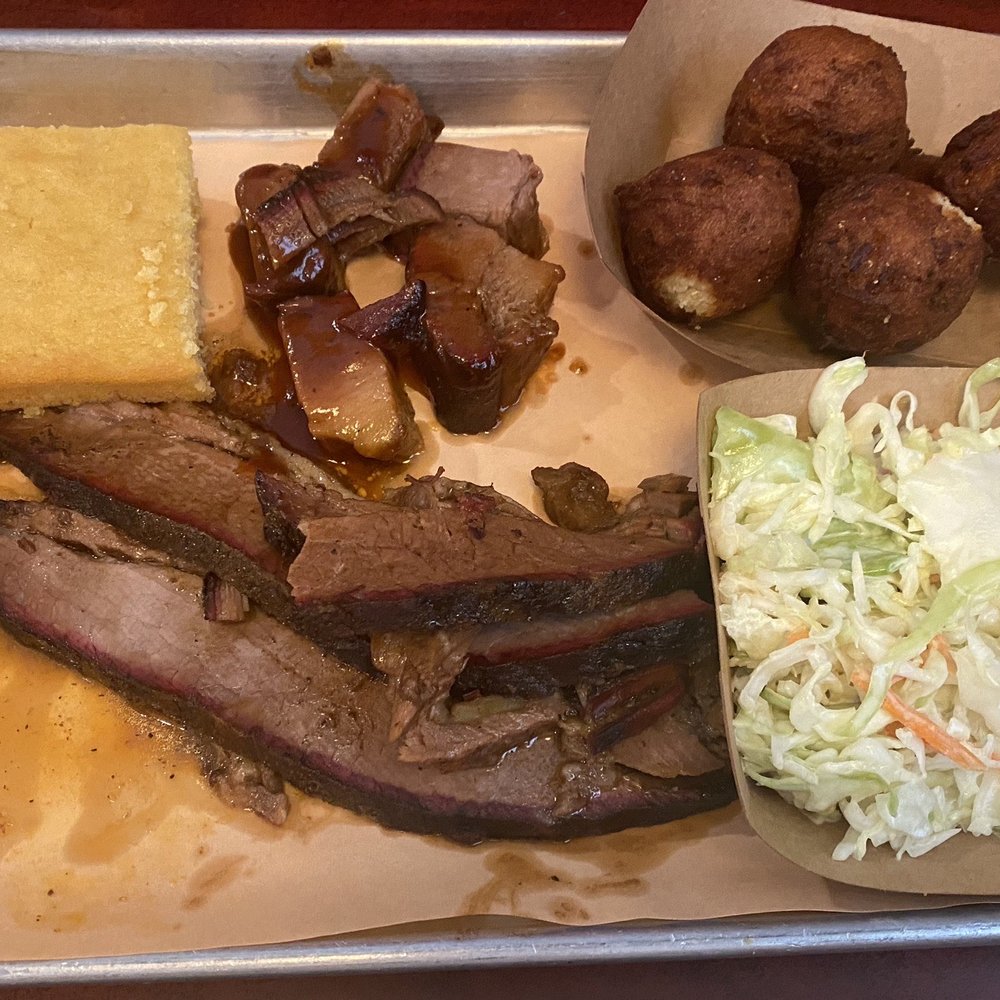 Two Drummers Smokehouse - Beef Brisket entree with side of hush puppies and cole slaw - Barbeque Near Me - Toano, Virginia Two Drummers Smokehouse - Beef Brisket entree with side of hush puppies and cole slaw - Barbeque Near Me - Toano, Virginia