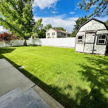 GreenArt Lawn Care Services - a backyard with a white fence - Lawn Services Near Me GreenArt Lawn Care Services - a backyard with a white fence - Lawn Services Near Me
