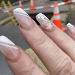 Nancy's Nail Salon - I did butterfly and silver dots