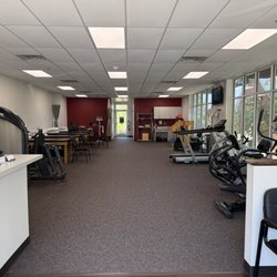 Carolina Physical Therapy and Sports Medicine - Wide-angle view of Carolina Physical Therapy Rock Hill gym floor, set up for Graston Technique and functional rehab.