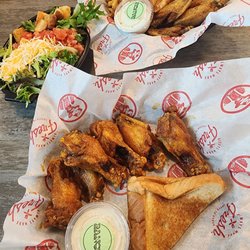 Slim Chickens - Top: lemon pepper extra crispy, all flats w/fries Bottom: cayenne dry rub with fresh salad.