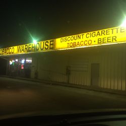 Tobacco Warehouse - Store front at night