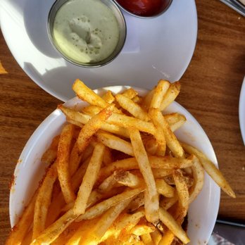 Seabirds Kitchen - Seasoned, but not that crispy fries with ketchup and Seabird sauce (so good!) $6.50 - Vegan Near Me - Costa Mesa, California