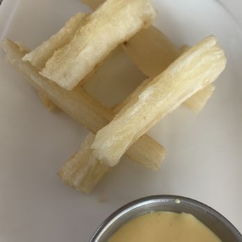 Sabor Mix Restaurant - Fried Yucca!  I already ate a few out of the stack!  Perfectly fried! - Peruvian Near Me - Jacksonville, Florida