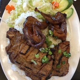 Rice plate with grilled quail and pork chop Rice plate with grilled quail and pork chop