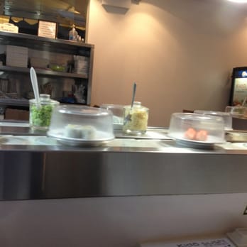 Kido Sushi - Conveyor belt with various food options. - Sushi Bars Near Me - Elmhurst, New York