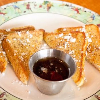 Legends Grill - a plate of french toast with syrup - American Near Me - Thackerville, Oklahoma Legends Grill - a plate of french toast with syrup - American Near Me - Thackerville, Oklahoma