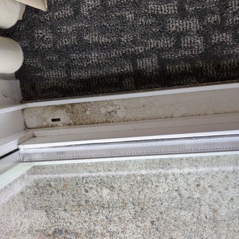Hallmark Resort - Dirt in track of sliding glass door in bedroom. - Resorts Near Me - Newport, Oregon Hallmark Resort - Dirt in track of sliding glass door in bedroom. - Resorts Near Me - Newport, Oregon