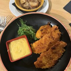 7556 Main Street Bistro - Captain crunch breaded chicken with hot German potatoe salad