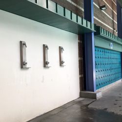 Pavilion Center Pool - Immediate pool area lockers and spray down
