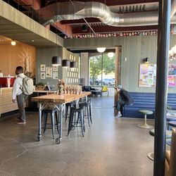 Redstart Roasters - Main seating area, additional seating beyond the wall