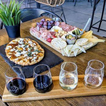 Sip Wine Garden - Charcuterie, fig and goat cheese flatbread with wine flight. Not sure what wines were had. - Wine Bars Near Me - Cibolo, Texas
