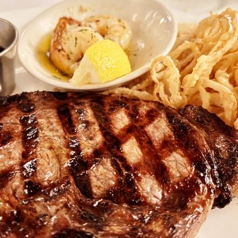 The Packing House - 16 oz. Boneless Ribeye with broiled shrimp - American Near Me - Milwaukee, Wisconsin The Packing House - 16 oz. Boneless Ribeye with broiled shrimp - American Near Me - Milwaukee, Wisconsin