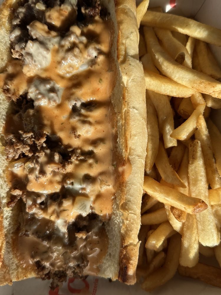 Tono Pizzeria + Cheesesteaks Logo