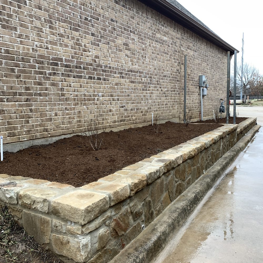 Stone Pro Outdoors - Replaced a very sloped and eroding side of our house with an awesome retaining wall with plant beds. - General Contractors Near Me - Haltom City, Texas Stone Pro Outdoors - Replaced a very sloped and eroding side of our house with an awesome retaining wall with plant beds. - General Contractors Near Me - Haltom City, Texas