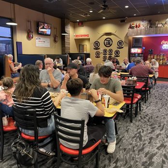 Porky Butts BBQ - Dining area, more booths and tables and self served fountain drinks area with utensils. - Barbeque Near Me - Omaha, Nebraska Porky Butts BBQ - Dining area, more booths and tables and self served fountain drinks area with utensils. - Barbeque Near Me - Omaha, Nebraska
