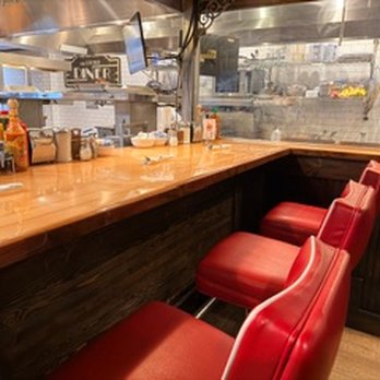 The Little Diner - Cute bar area with very comfy stools and a view of the open kitchen - Diners Near Me - Vail, Colorado