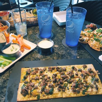 Topgolf - Asian sesame wings, chicken nachos and steak flatbread! - Golf Near Me - Oklahoma City, Oklahoma Topgolf - Asian sesame wings, chicken nachos and steak flatbread! - Golf Near Me - Oklahoma City, Oklahoma