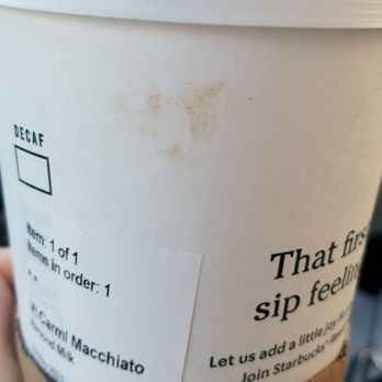 Starbucks - a hand holding a cup of coffee - Coffee & Tea Near Me - Fairfax, Virginia Starbucks - a hand holding a cup of coffee - Coffee & Tea Near Me - Fairfax, Virginia