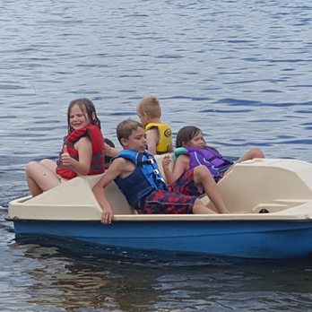 Betsy Ross Resort - Kids enjoying a ride on the paddle boat provided by the resort. Several water toys included in the price of your stay! - Hotels Near Me - Alexandria, Minnesota Betsy Ross Resort - Kids enjoying a ride on the paddle boat provided by the resort. Several water toys included in the price of your stay! - Hotels Near Me - Alexandria, Minnesota